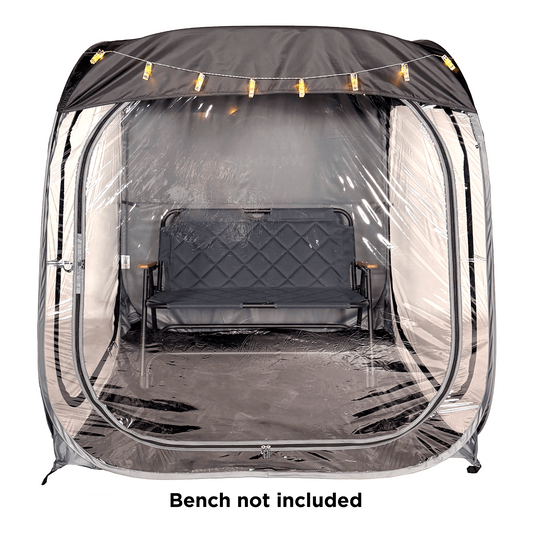 A WeatherPod pop-up tent pod in dark gray with a black detachable roof, featuring clear PVC, string lights along the top, and the WeatherPod logo printed on the back. on a white background with a text overlay that says 'Bench not included'.